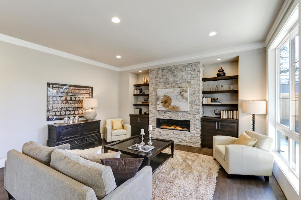 Family Room with Stack Stone Fireplace and Recessed Lighting