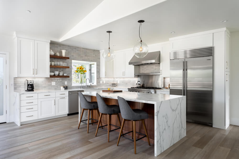 Vinyl plank flooring and real stone kitchen island