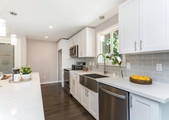 White-Kitchen-view-of-stove-and-custom-cabinets